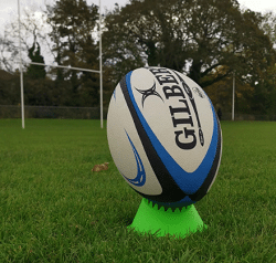 setting up the ball to kick at goal