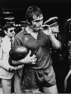 Old school rugby player smoking after the game